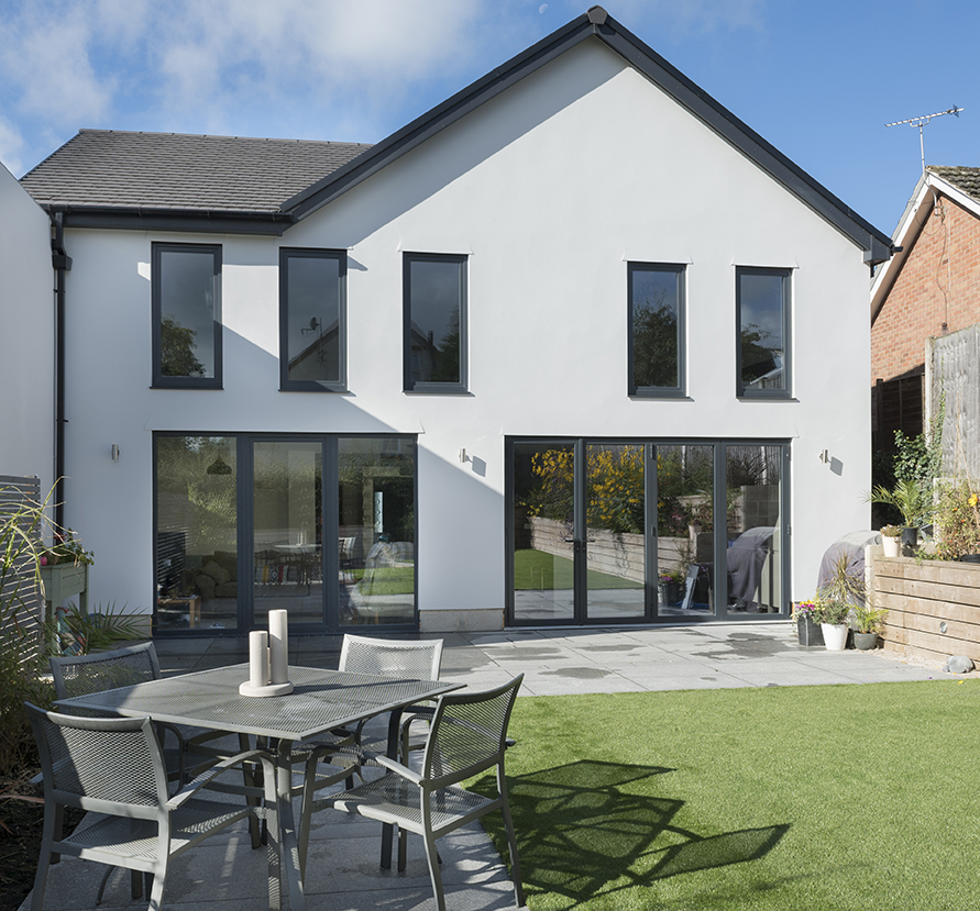 Mirrored bi-fold external doors on paved space