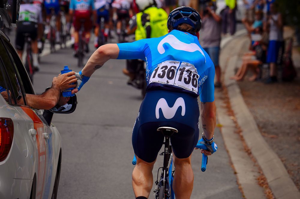 Jasha Sutterlin (Movistar Team) gets some refreshments for his teammates