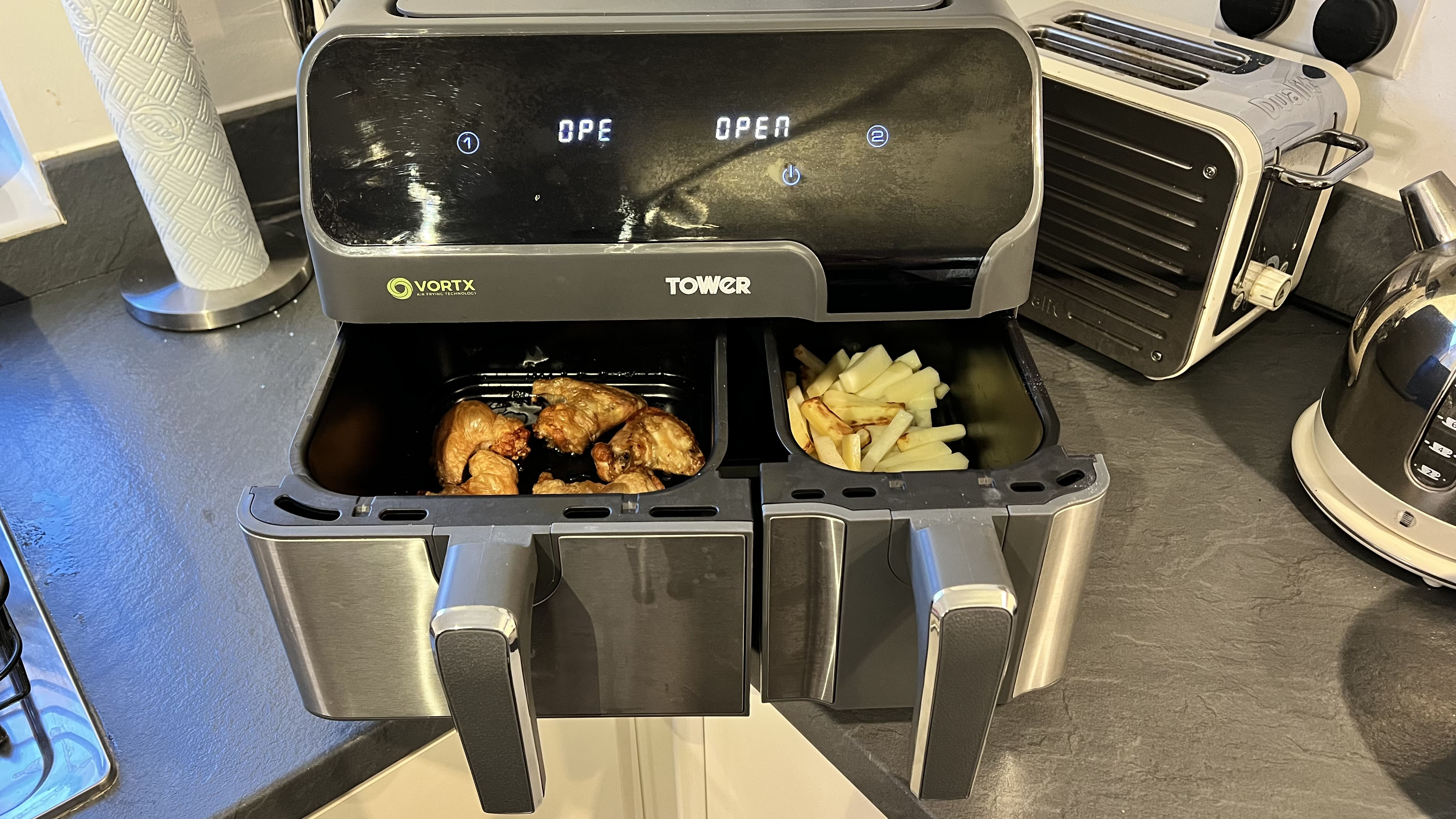 Chicken wings and homemade chips are shown side by side in the Tower Vortx Eco Duo air fryer