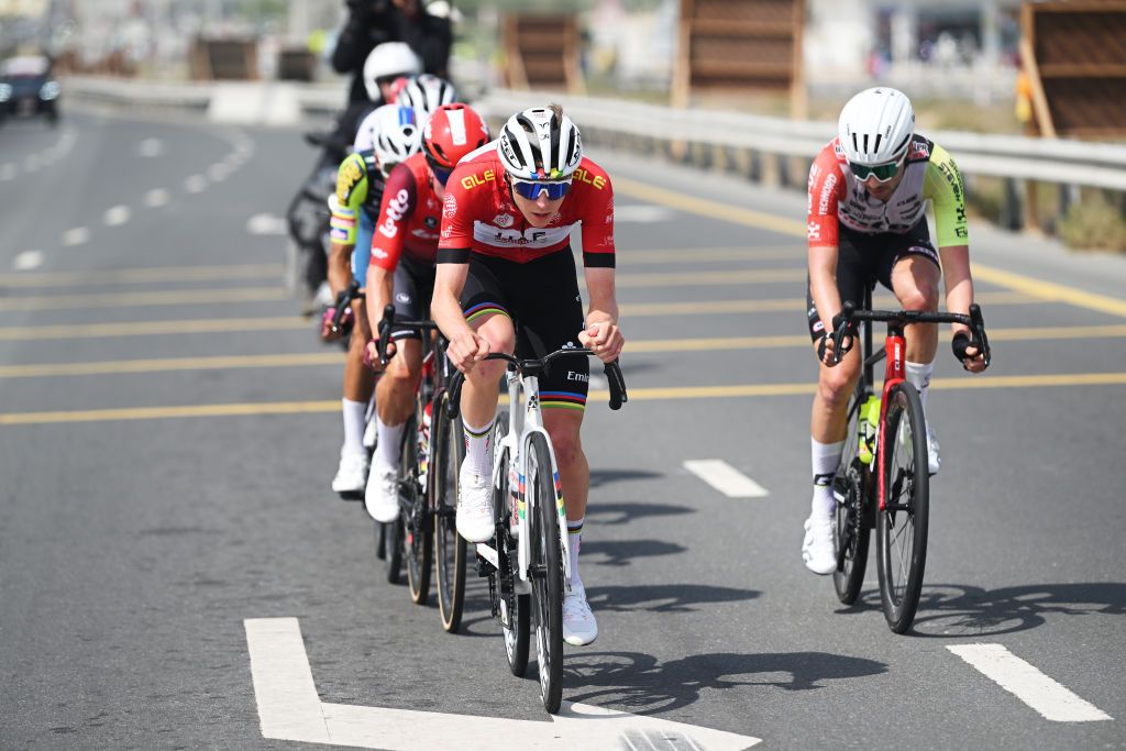 DUBAI UNITED ARAB EMIRATES FEBRUARY 21 LR Tadej Pogacar of Slovenia and UAE Team Emirates Red Leader Jersey and Kobe Goossens of Belgium and Team IntermarcheWanty compete during the 7th UAE Tour 2025 Stage 5 a 160km stage from American University Dubai to American University Dubai UCIWWT on February 21 2025 in Dubai United Arab Emirates Photo by Dario BelingheriGetty Images