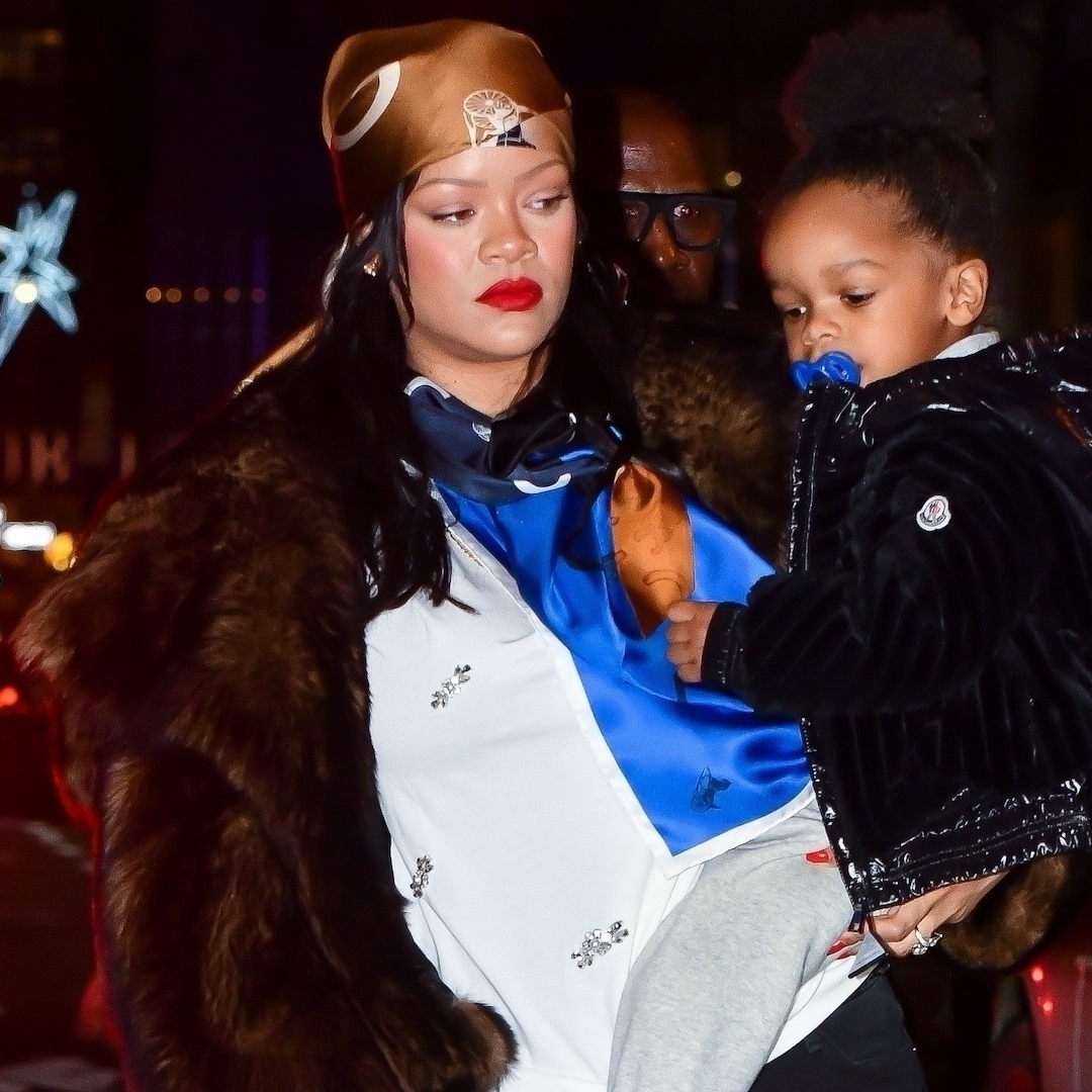 Rihanna was spotted in NYC wearing cargo pants, a fur coat, a silk head scarf, and the single-strap bag trend