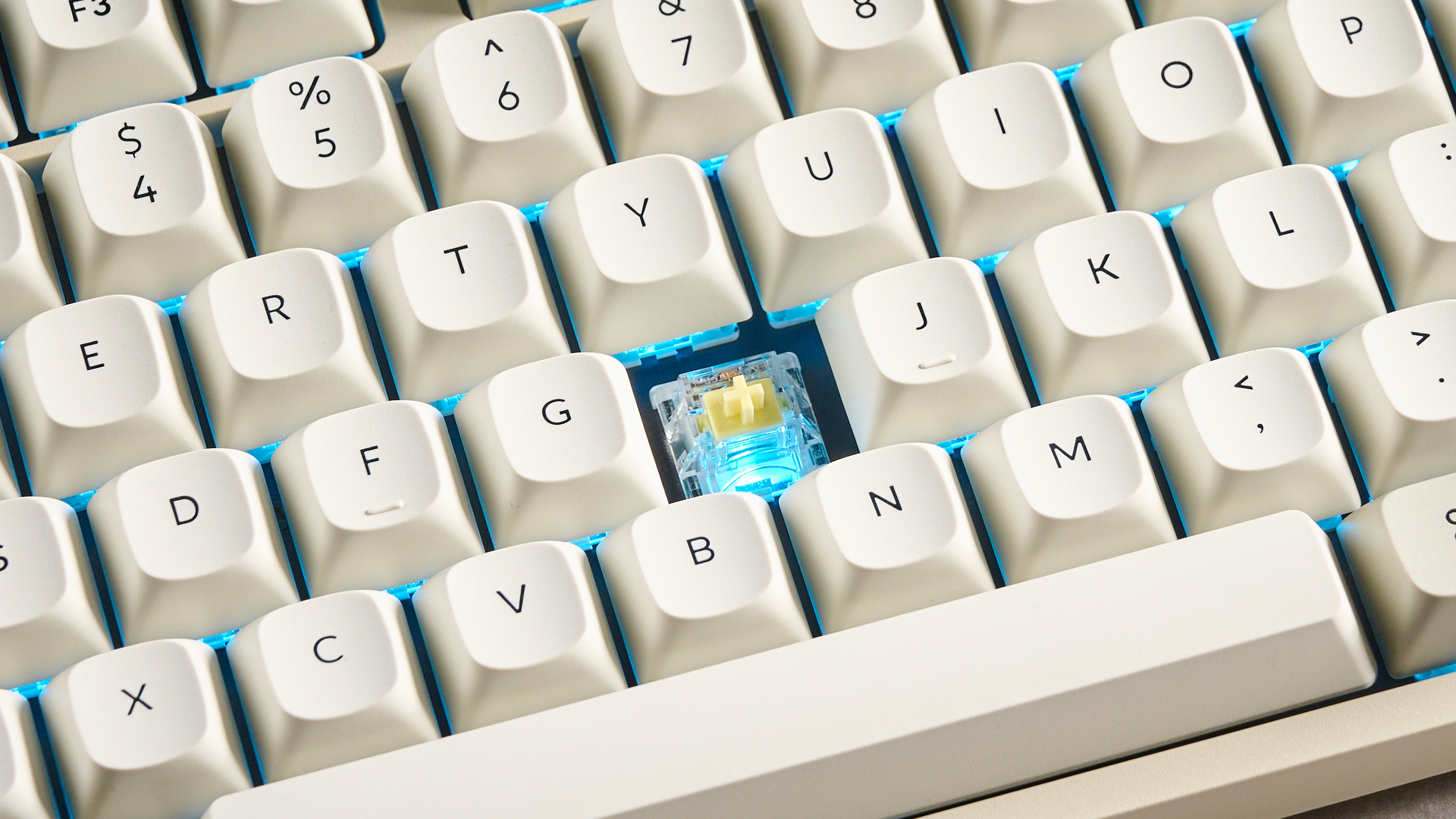 Keychron C1 Pro 8K photographed in front of a blue background.