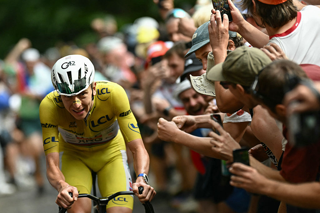  Tadej Pogacar attacks to take the lead in a lone breakaway in the final kilometers of the 14th stage of the 113th edition of the Tour de France