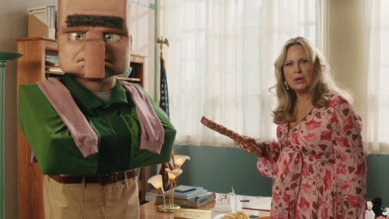 Jennifer Coolidge standing next to Nitwit holding a baguette in A Minecraft Movie