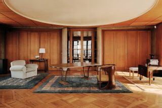 Athena Calderone collection of rugs for Beni Rugs shown in a wood panelled room