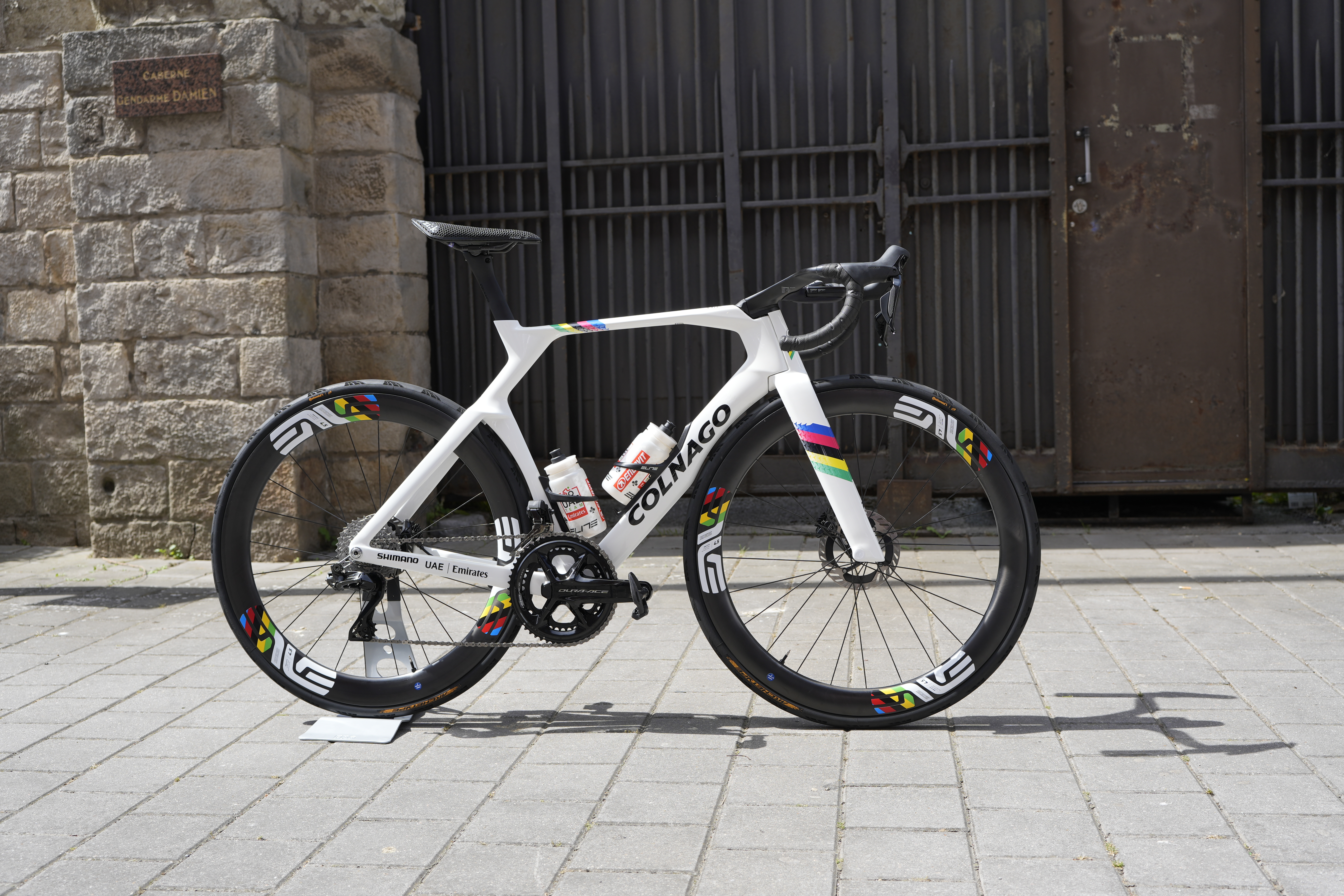 Colnago Y1Rs in profile standing on bricked road