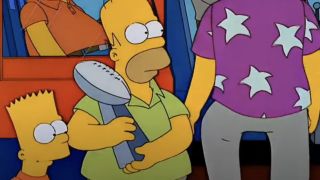 Homer holding the Vince Lombardi trophy on The Simpsons