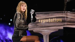 Taylor Swift plays piano during Reputation stadium tour