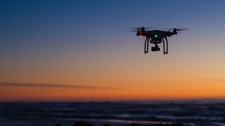 Drone flying over the ocean