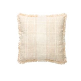 A fringed checked bedroom pillow