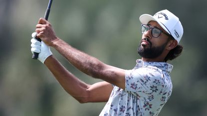 Akshay Bhatia holds his finish on an iron shot