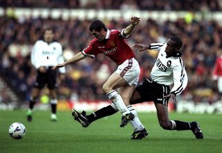 24 Oct 1998: Roy Keane of Manchester United is tackled by Paulo Wanchope of Derby during the FA Carling Premiership match at Pride Park in Derby, England. The game ended in a draw 1-1. \ Mandatory Credit: Shaun Botterill /Allsport