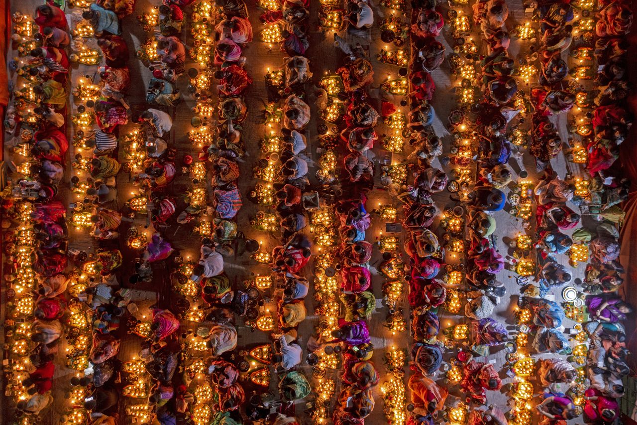 Hindu devotees gather in Dhaka for Rakher Upobash, fasting and praying with incense and oil lamps to honour Baba Lokenath.