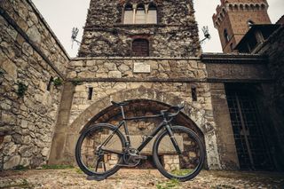 Colnago C68 rim stands in front of a church