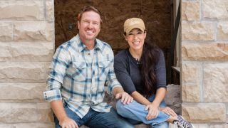 Chip and Joanna Gaines in front of a castle in Fixer Upper: Welcome Home 