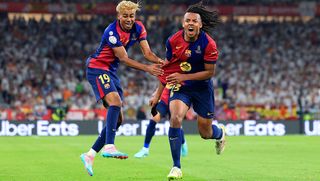 Jules Kounde of FC Barcelona celebrates scoring his team's third goal with Lamine Yamal during the Copa del Rey Final match between FC Barcelona and Real Madrid in April 2025