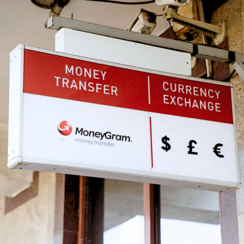 A sign for MoneyGram International Inc. money transfer and currency exchange services