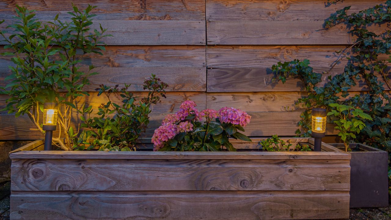 Raised bed with solar powered garden lights