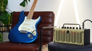 An electric guitar and practice amp in a home