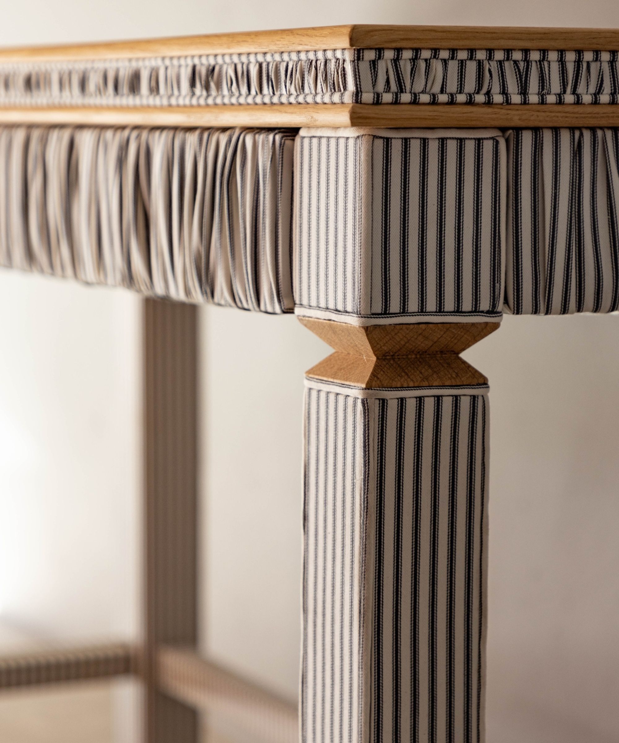 A fabric covered striped desk