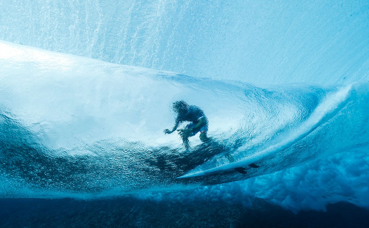 Surfers at the Olympics underwater