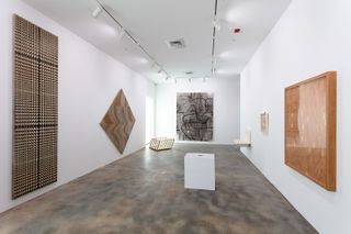 White room filled with art work