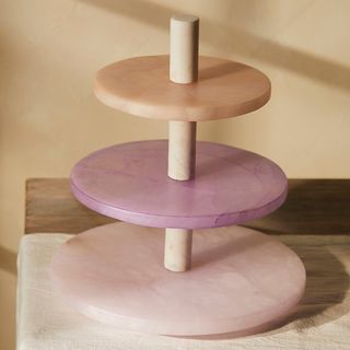 Tiered serving stand in alabaster and wood in tonal violet hues