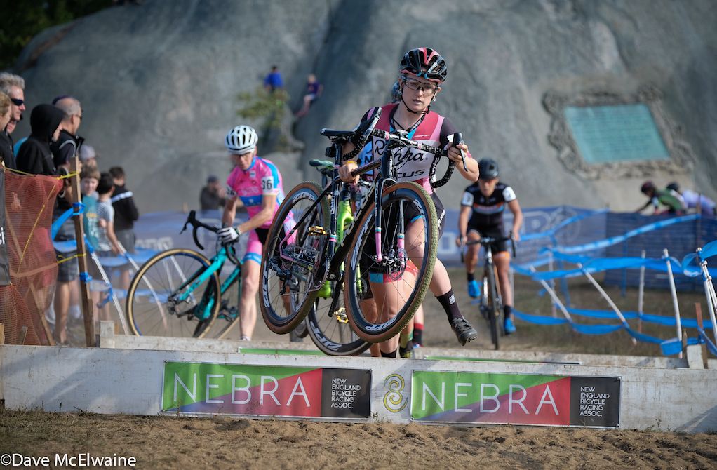 Ellen Noble (Aspire Racing) leading the race at the first set of barriers