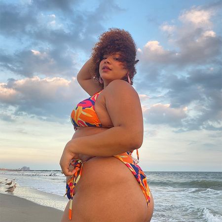 ana wears multi colored bikini on a beach