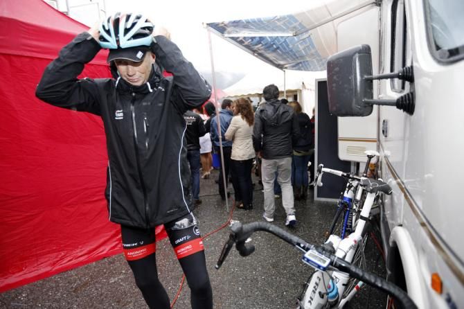 Chris Horner (RadioShack Leopard) bundles up after a rainy, cold day at the Vuelta