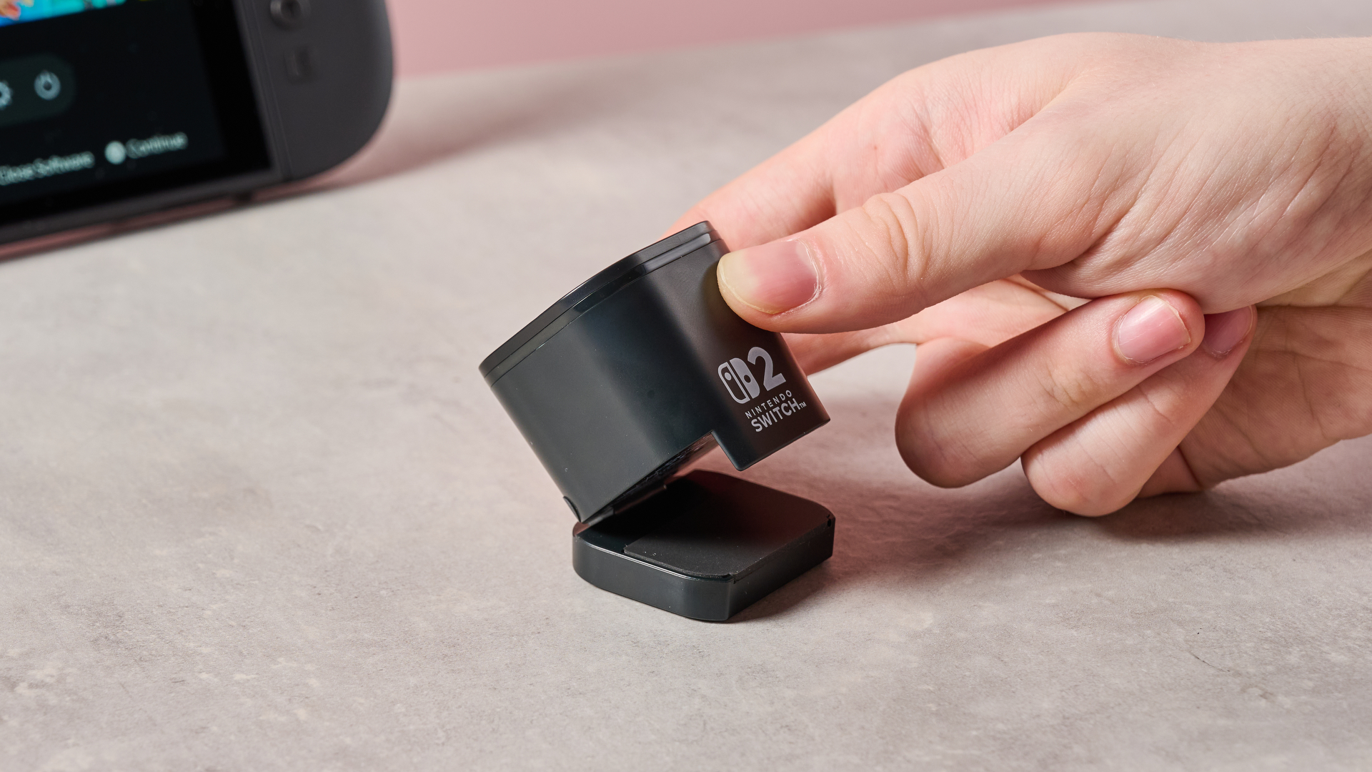 Man opening clip on Hori USB Camera for Nintendo Switch 2