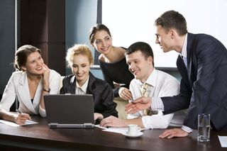 Team undergoing sales training in a boardroom