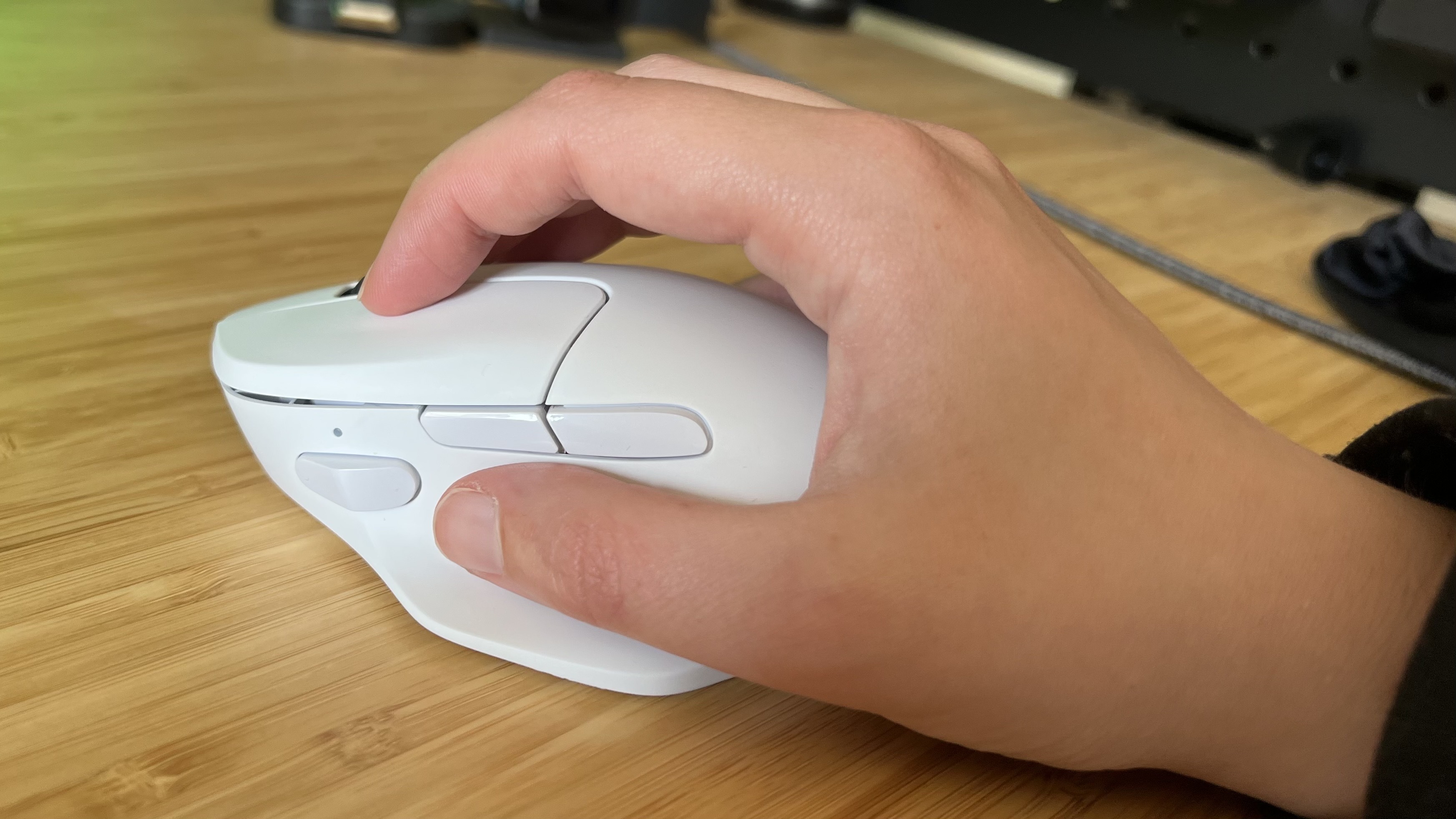Hand placed in a claw grip over the Keychron M7 8K gaming mouse