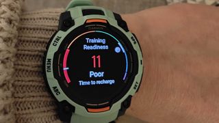 Garmin instinct 3 in neotropic green on wrist