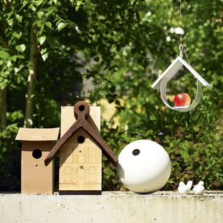 Bird houses and feeder in a garden