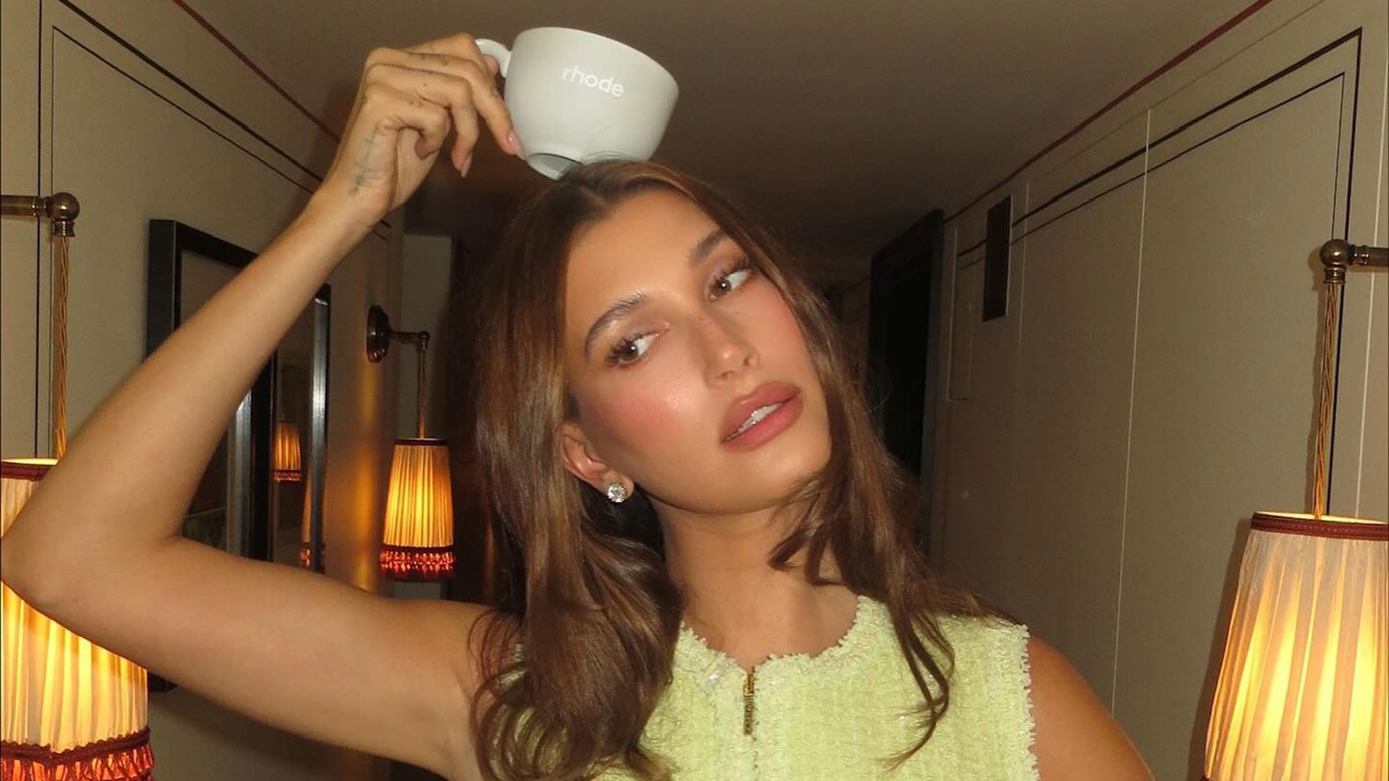 Hailey Bieber wears a lime green skirt suit.