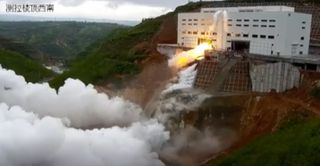 China rocke engine hot-fire test with flame erupting from new facility new facility in Tongchuan.