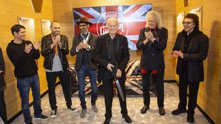 Gibson Garage London: Jimmy Page cuts the ribbon in the company of Brian May, Tony Iommi, Cesar Gueikian and Mark Agnesi