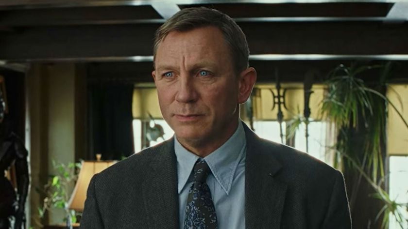 Daniel Craig looks past the camera
