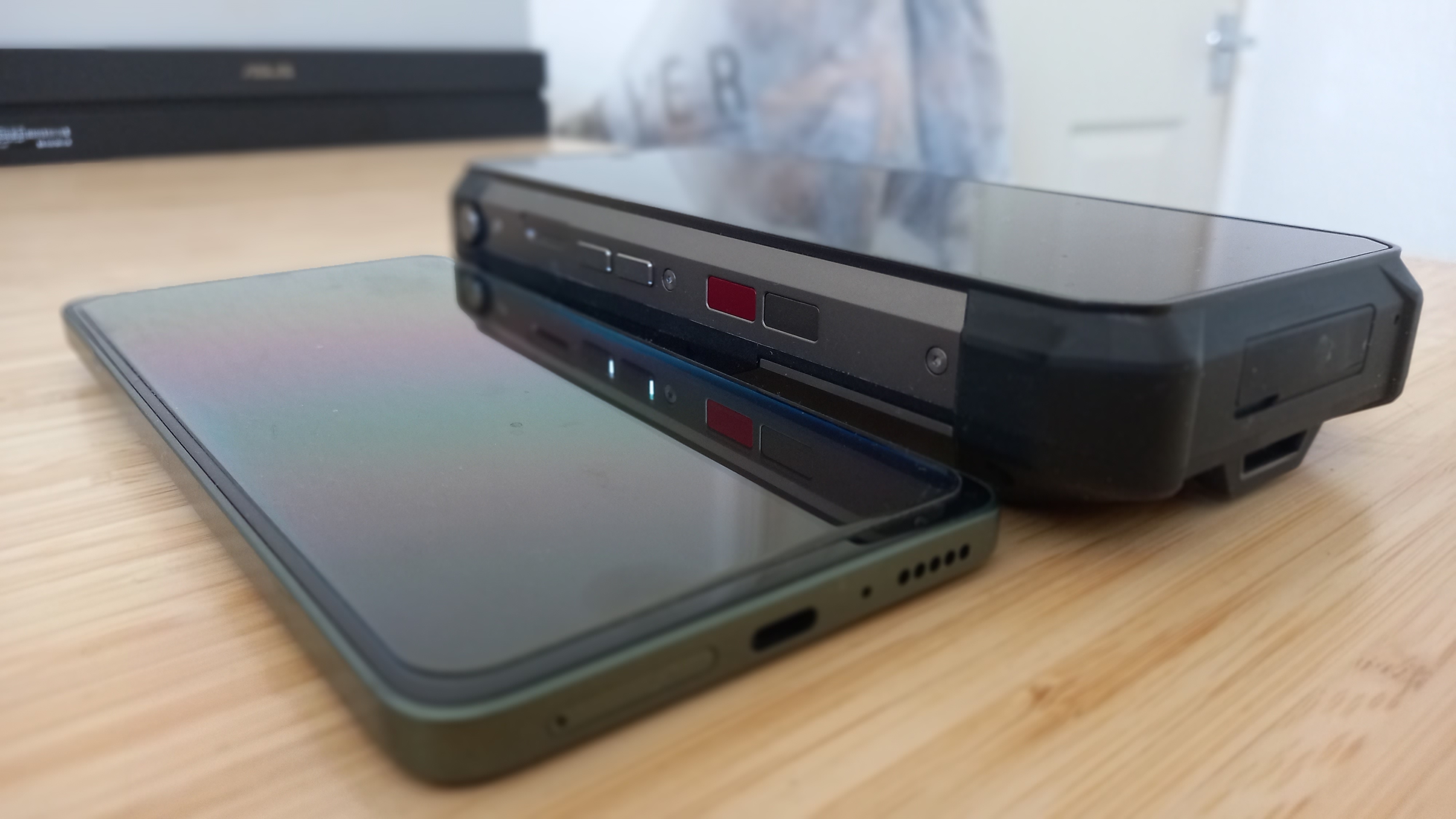 Tank 3 Pro on desk next to a much smaller phone