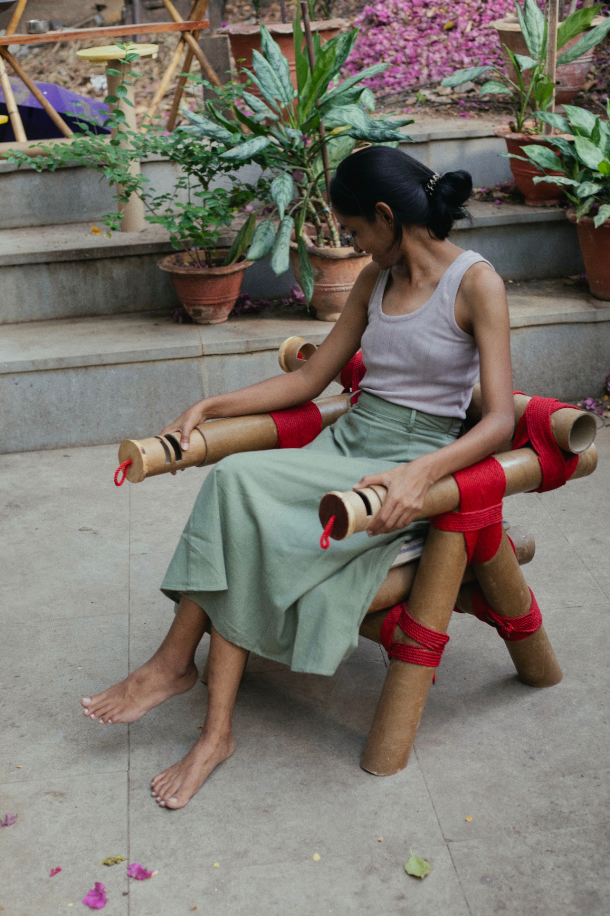 chair made from cardboard tubes tied together with rope