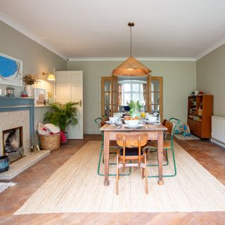 dining room with wooden dining table on a jute rug