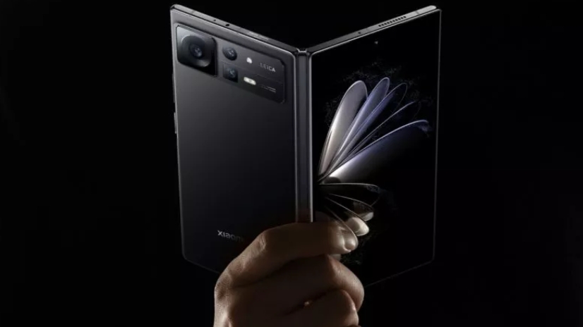 A Xiaomi Mix Fold 2 from the back, in someone's hand
