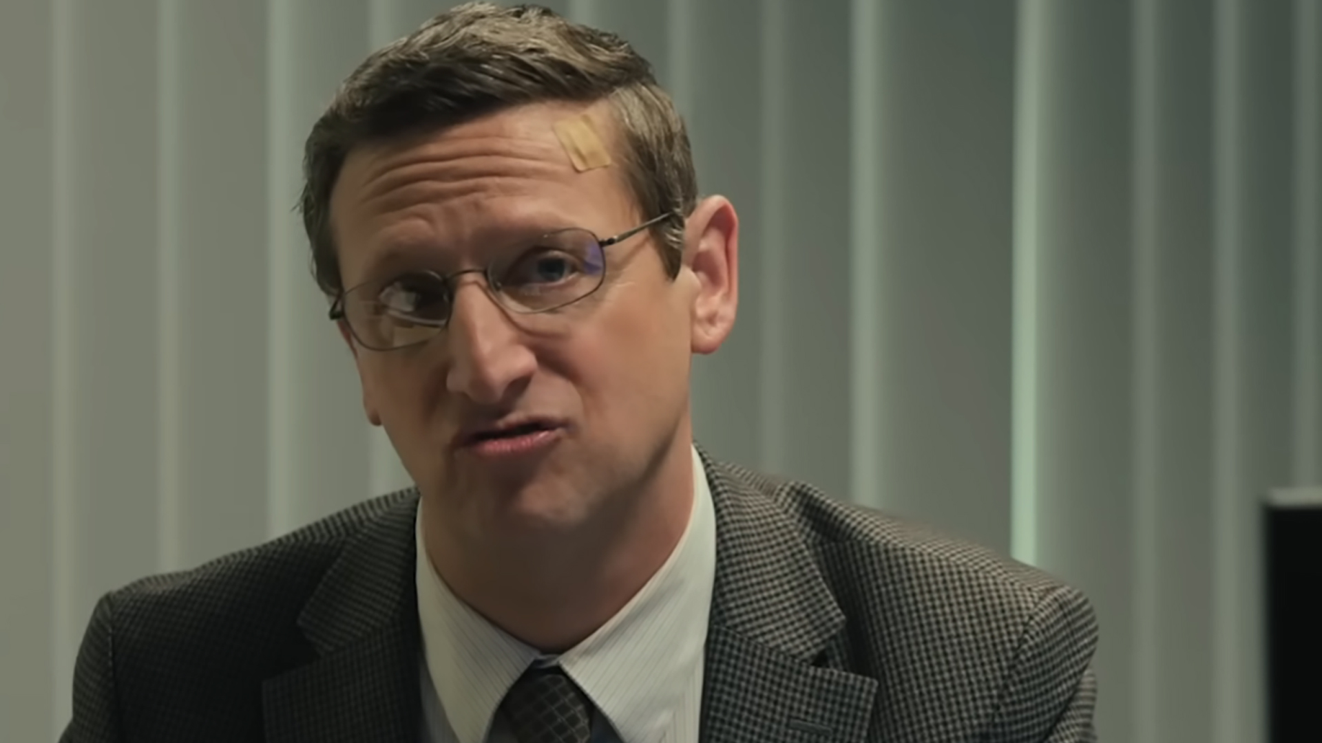 Tim Robinson as Ron Trosper, looking quizzical