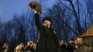 Groundhog handler AJ Dereume holds Punxsutawney Phil after he did not see his shadow predicting an early Spring during the 138th annual Groundhog Day festivities on Friday February 2, 2024 in Punxsutawney, Pennsylvania.