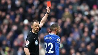 Chelsea's Hakim Ziyech is shown a red card in the Blues' Premier League game at Tottenham, but it is changed to a yellow following a VAR check.