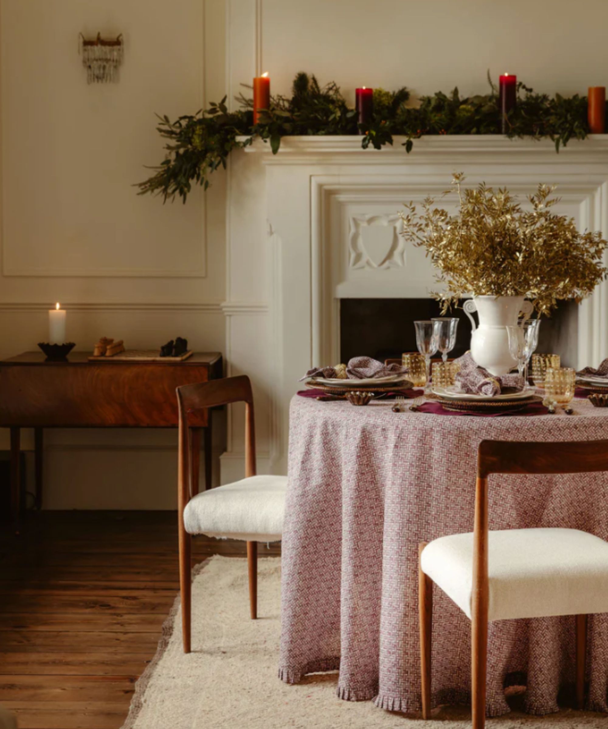 Christmas table with fireplace and decorated mantel