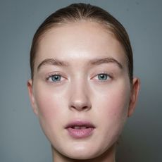 a close up of a model's face backstage at Rami Al Ali - dehydrated skin
