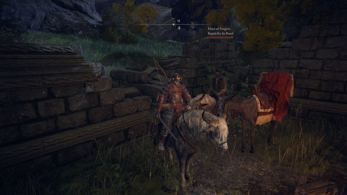 Two players mounted on torrent hanging out by merchant Kale's beast of burden