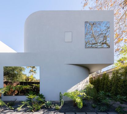 the white exterior of Villa Radius in LA on a sunny day